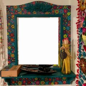 A boho vibe to this little shelf that adorns your wall